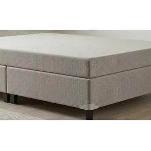 A low-profile box spring designed to support a short queen mattress, ensuring proper support and longevity.