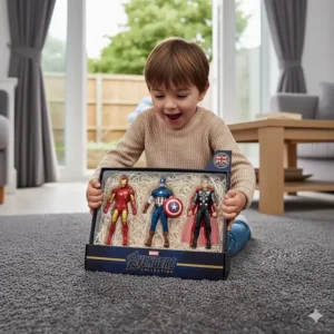 A young boy excitedly opening an Avengers gift box on a grey carpet, perfect as a birthday or Christmas present.