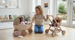 A toy doll pram being pushed by a child, mimicking real-life nurturing play.