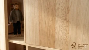 Close-up of the FSC-certified sustainable wood texture on a high-quality dollhouse frame.