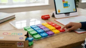 Child's finger pressing a button on a sequence of magnetic Osmo Coding blocks with the tablet interface shown.