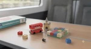 A child building a sandcastle model using pieces from a durable travel building blocks set during a UK seaside holiday.