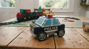 A wrapped birthday gift box featuring a magnetic building vehicles set for kids.