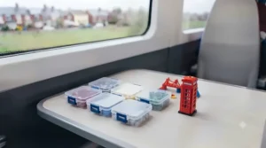 Assorted miniature building sets packaged in pocket-sized boxes for easy holiday packing.