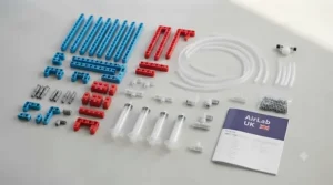 Flat lay of colourful plastic tubes, syringes, and bricks included in the pneumatic construction kit.